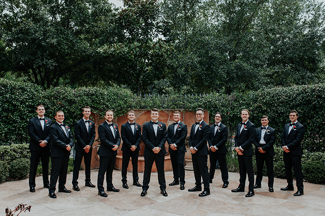 real wedding houston wedding the woodlands resort & conference center outdoor garden with fountain groom and groomsmen black tuxedos men's wedding attire