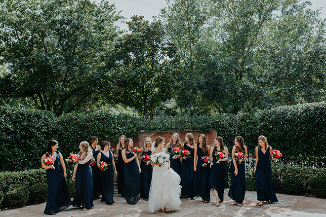 real wedding houston wedding the woodlands resort & conference center outdoor garden bridal party blue bridesmaids dresses white bridal bouquet