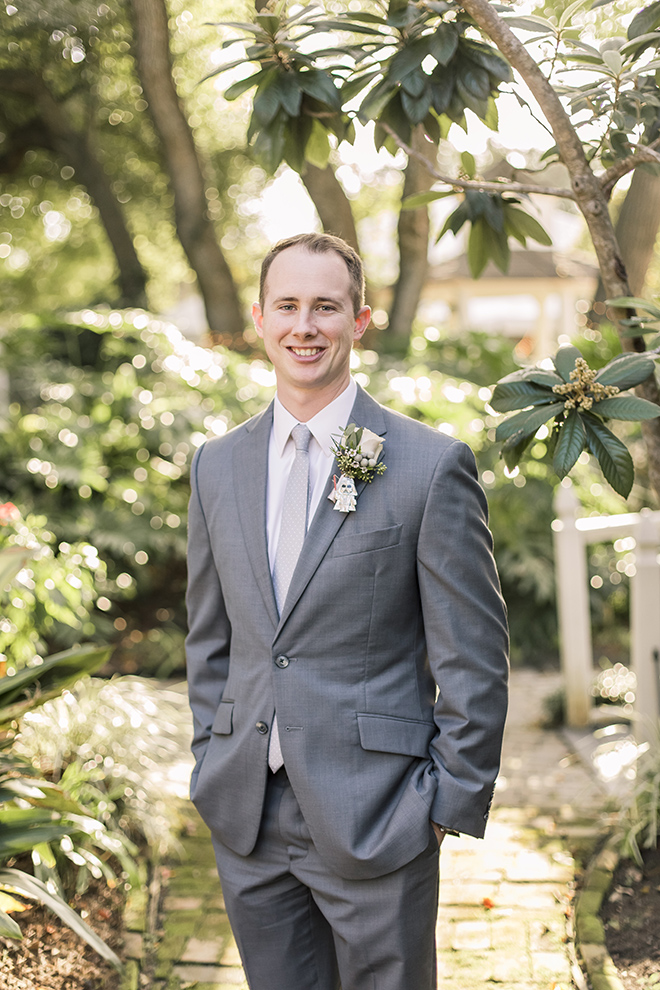 groom portrait butler's courtyard wedding league city haute flowers boutonniere 