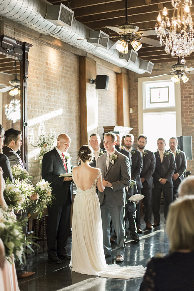 butler's courtyard houston wedding venue ceremony natural light exposed brick crystal chandelier