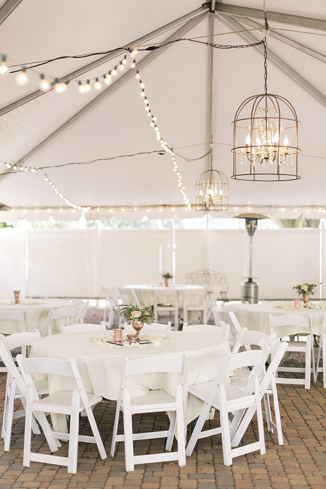 rustic elegant vintage wedding reception butler's courtyard white tables chairs birdcage chandeliers string lights