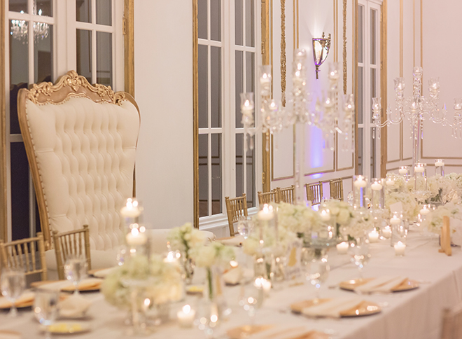 houston wedding, chateau cocomar, white and gold decor, wedding reception, floral centerpiece with white flowers, wedding reception decor, crystal chandeliers, luxe chateau cocomar wedding