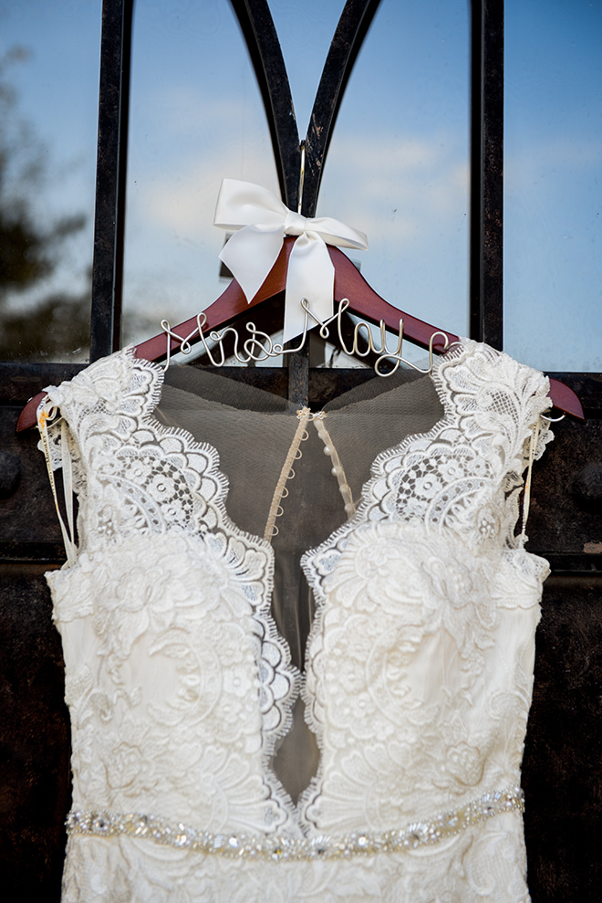 rustic autumn wedding, briscoe manor, kiss and makeup houston, custom wedding dress hanger, white lace wedding dress with beaded waist-line