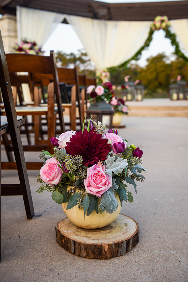 rustic autumn wedding, briscoe manor, kiss and makeup houston, outdoor wedding ceremony, string lights, burgundy and pink arrangements