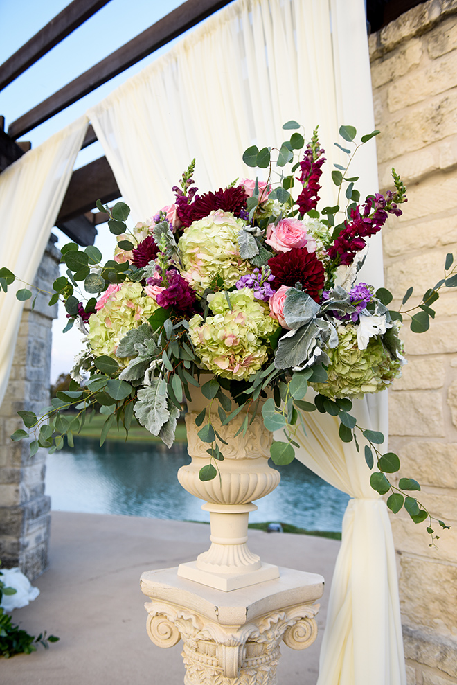 rustic autumn wedding, briscoe manor, kiss and makeup houston, outdoor wedding ceremony, string lights, ceremony decor, burgundy and pink arrangement