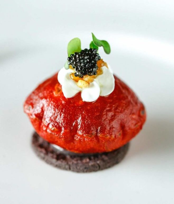 Puffy beet tostada appetizer with crema and Osetra caviar by Armandos 