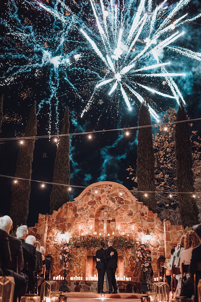 outdoor ceremony, twinkle lights, candes, carpet runner, madera estates, ama by aisha, same sex wedding, gay wedding, lgbt, real wedding, fireworks, spanish-inspired wedding, vintage