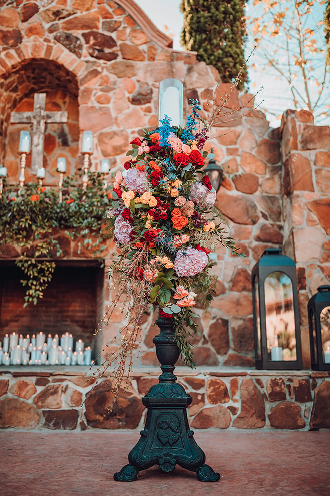 ceremony decor, flowers, outdoor ceremony, red, yellow, blue, saffron, flowers, madera estates, candles