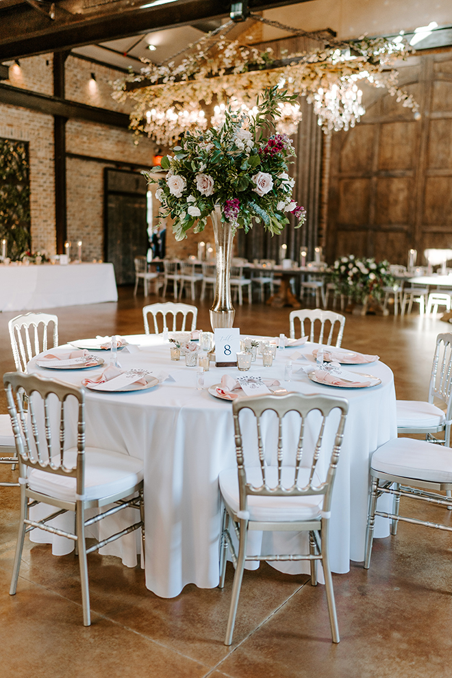 white linens, floral centerpieces, tall, chiavari chairs, silver, blush, burgundy, roses, reception decor, iron manor