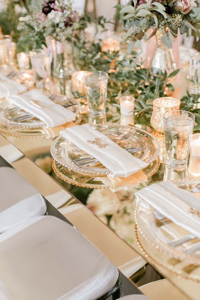 reception decor, greenery runner, floral centerpieces, gold place setting, candles, romantic, flowers, tall centerpieces