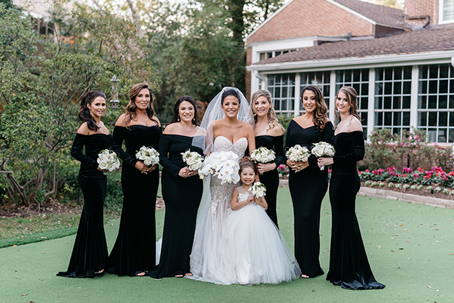 black bridesmaids dresses, off the shoulder, strapless bridal gown, long veil, orchid bouquet, white, elegant, classic, flower girl