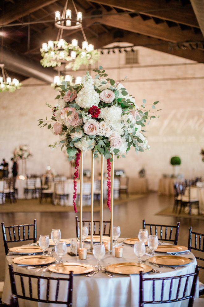 Blush and wine floral table centerpiece for reception. 