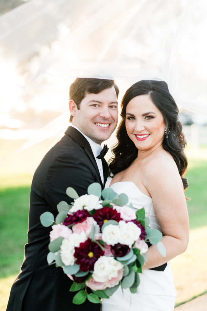 Fall bride and groom portrait with blush and wine bouquet. 