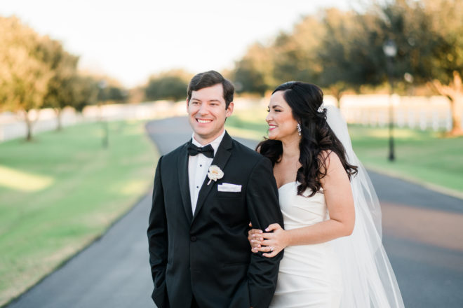 Fall groom and bride smiling outside. 