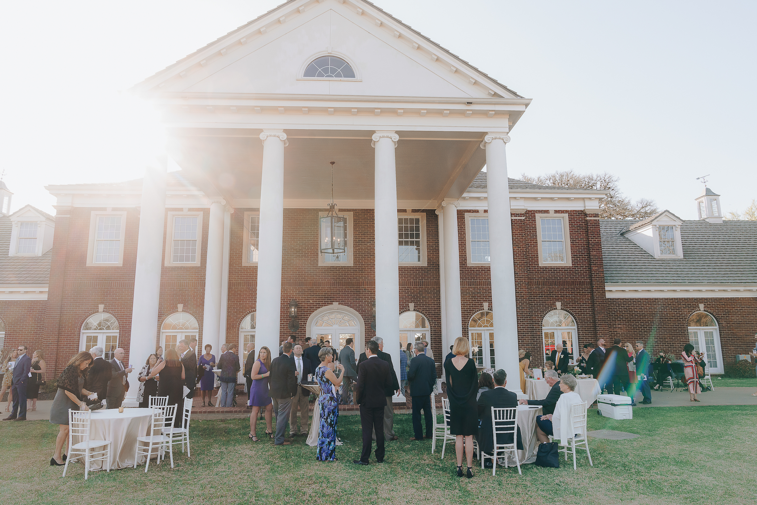 Exterior shot of the Mansion at ColoVista with guests waiting for the reception.