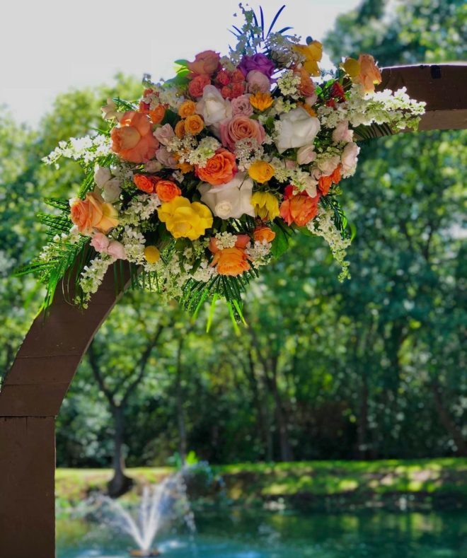 Multi-colored orange, white, and yellow flower arrangements. 