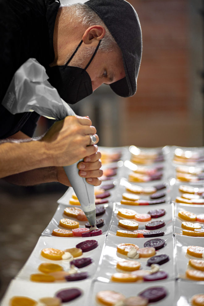 Chef Adam Paul of Jackson and Co Catering prepares a dish at The Astorian.