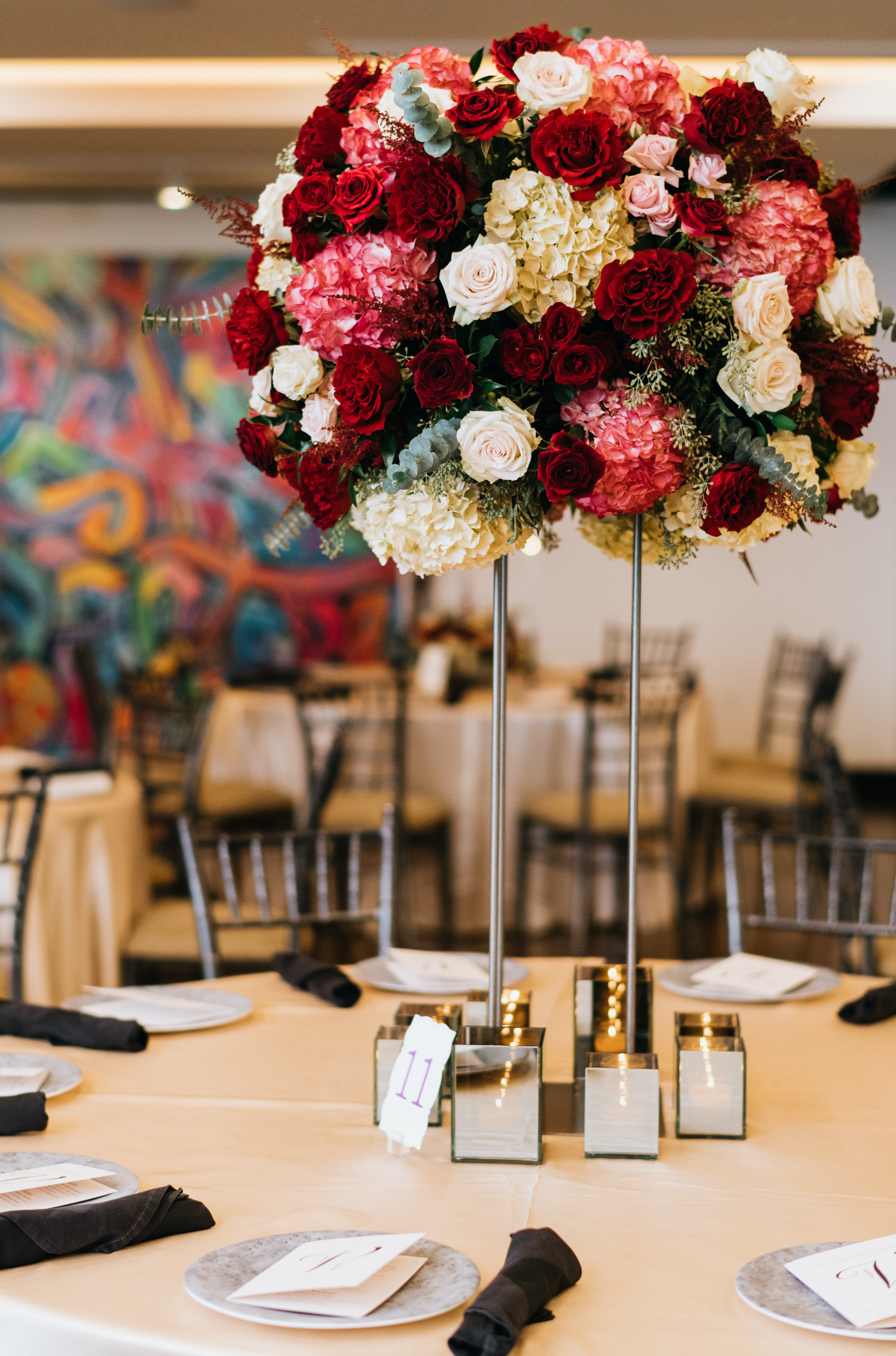 Beautiful flower centerpiece with red and white roses and hydrangea.