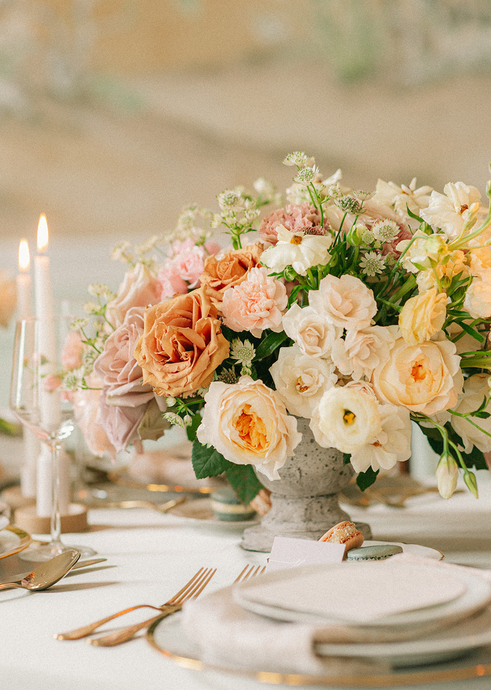 Artfully curated flower arrangements with garden roses and hill country wildflowers in buttercream, copper and peach hues.