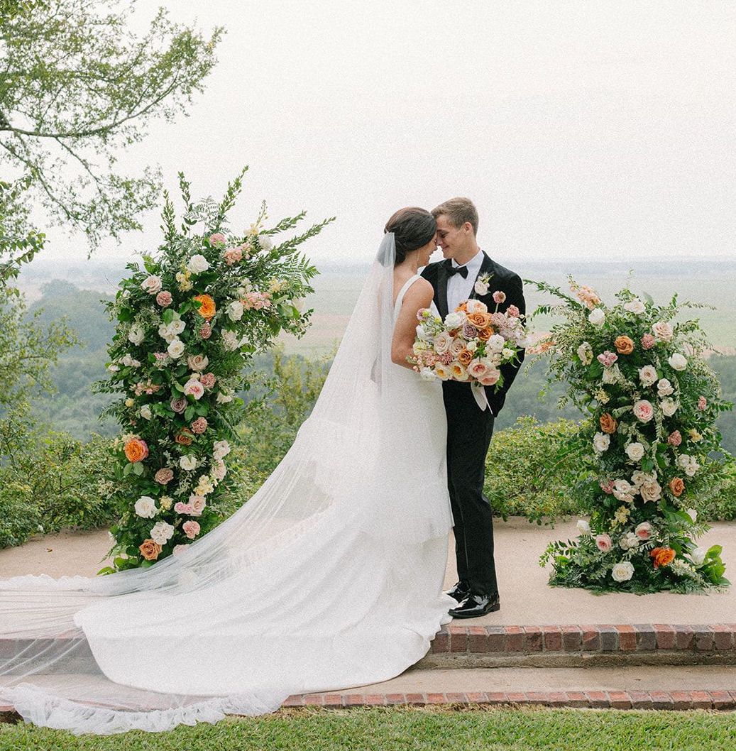 Bride and Groom embrace at the alter during their hill country artfully curated styled shoot.