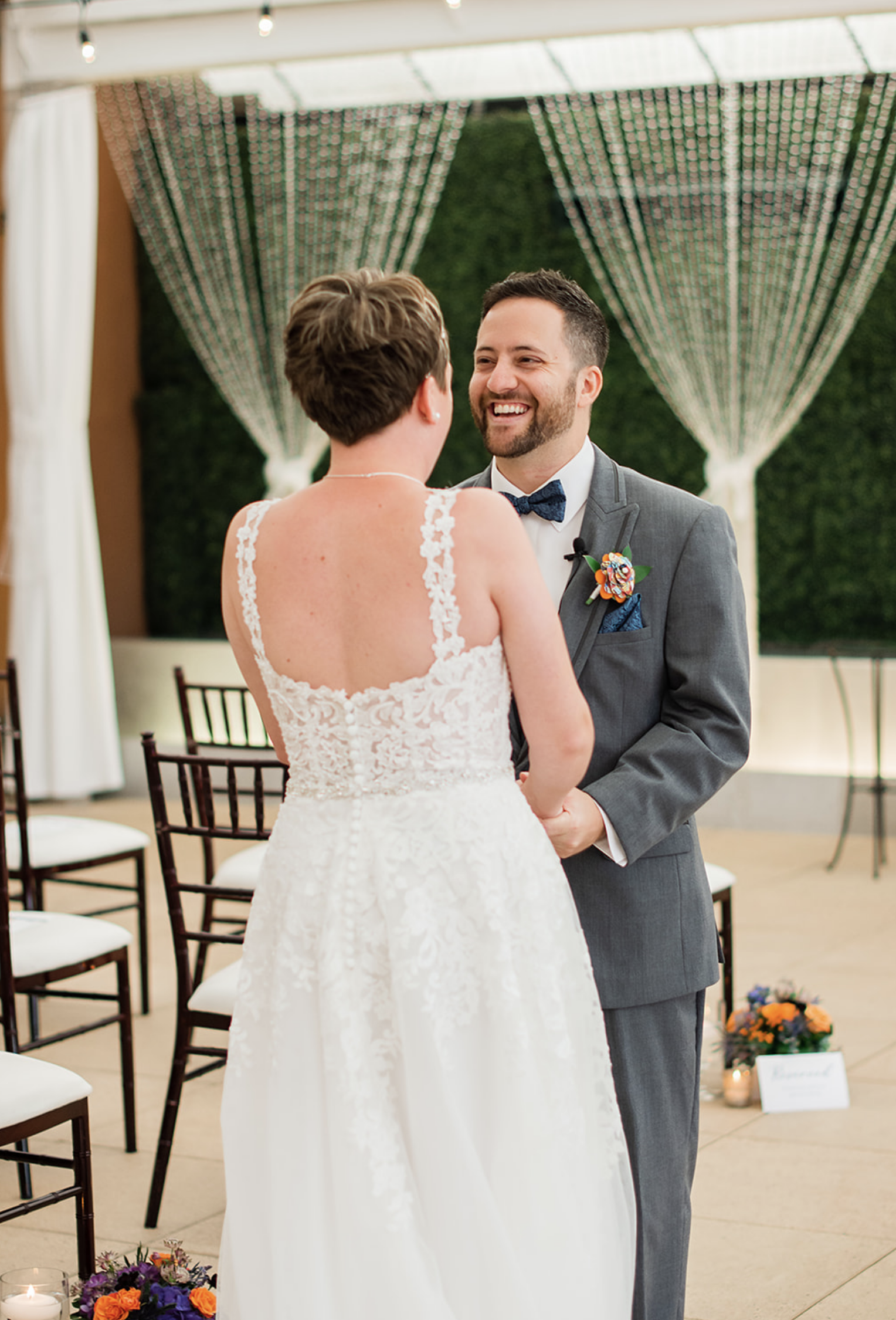 The bride and groom's first look before the whimsical jewel-toned wedding.