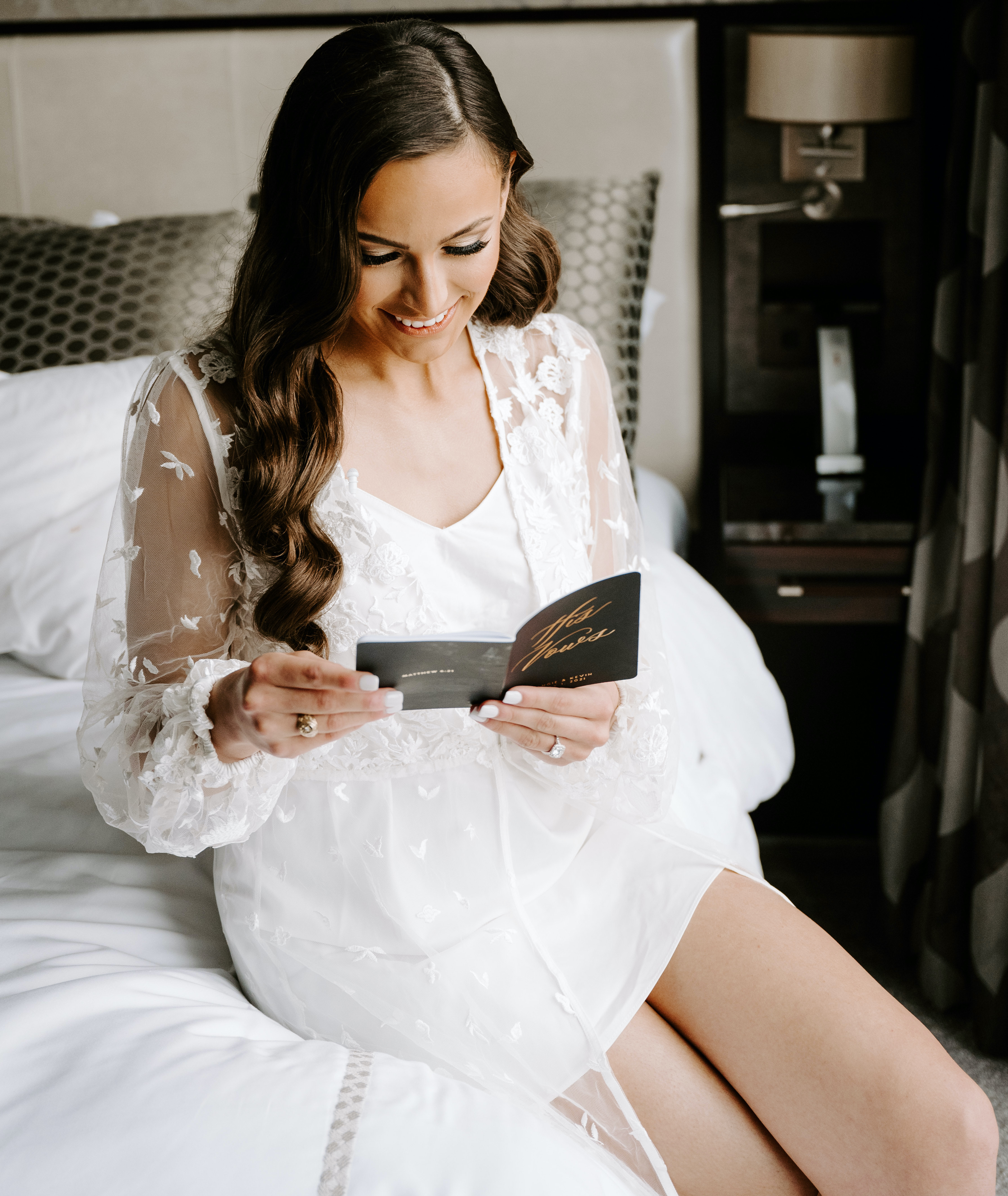 The bride reads her groom's vows to her before their wedding ceremony.