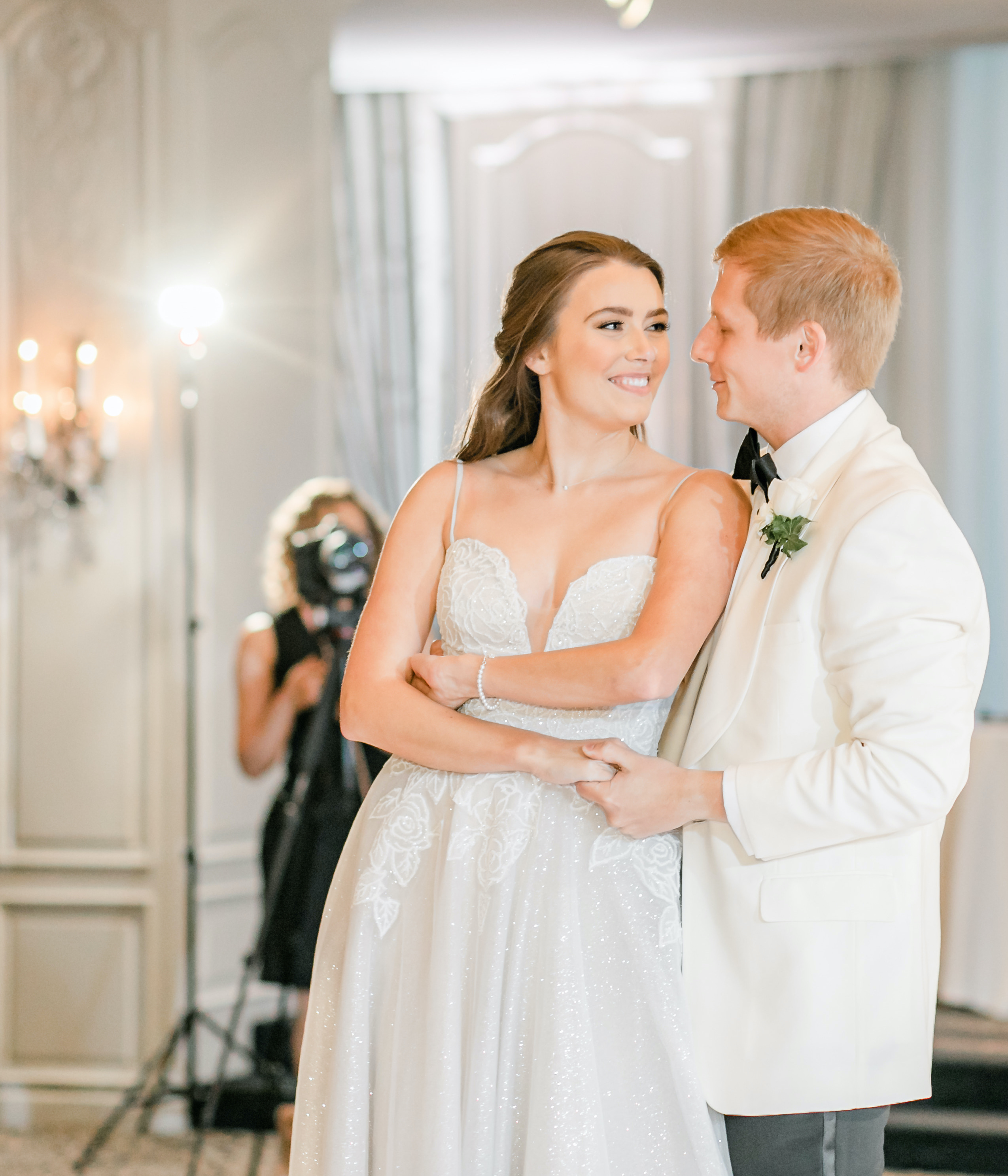 The bride and groom dance together at their wedding reception in the Houston museum district.