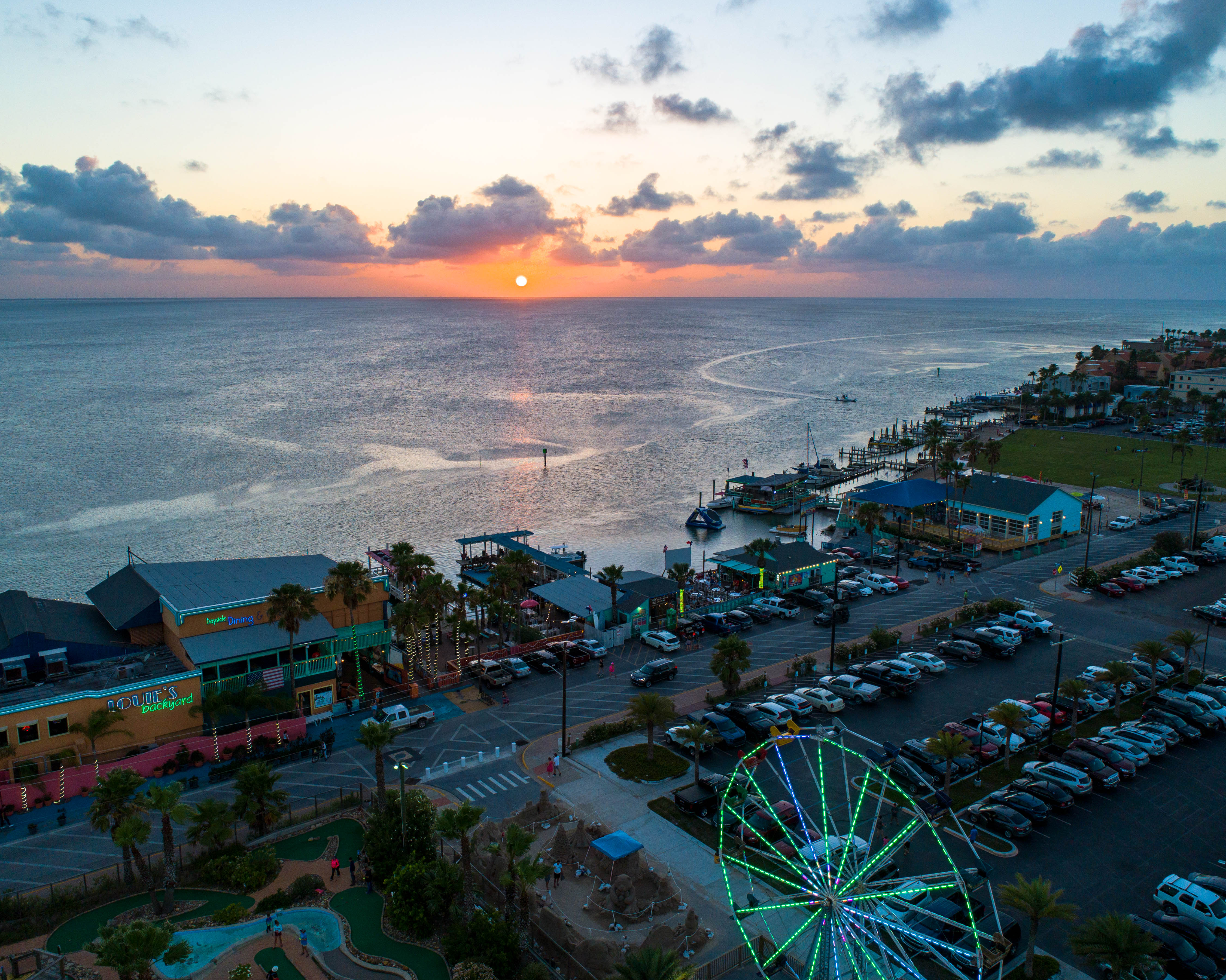 The sun is setting on the bay in South Padre Island, TX.