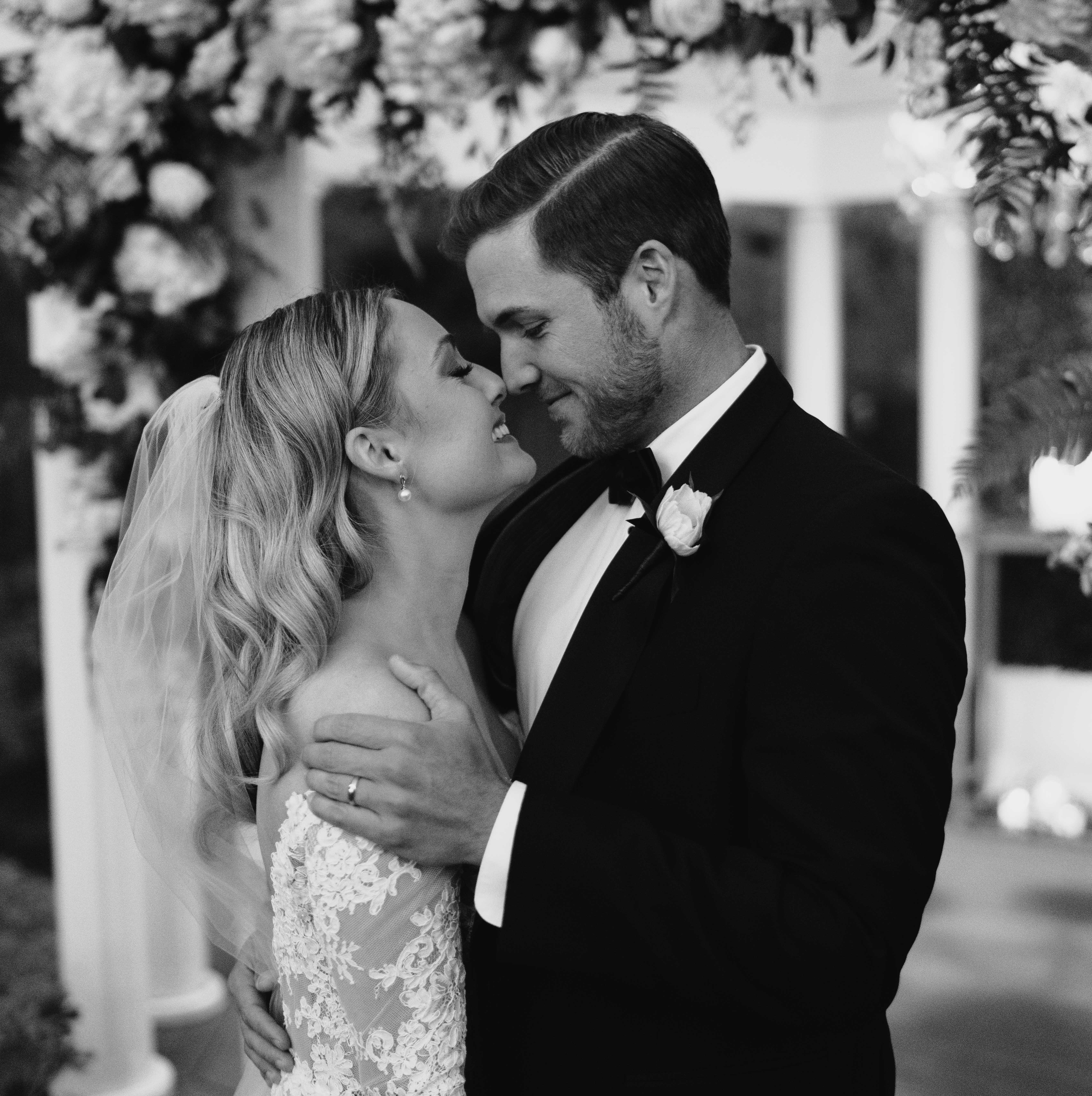 A black and white photo of Jordan Kimball and Christina Creedon on their wedding day in Houston, TX.