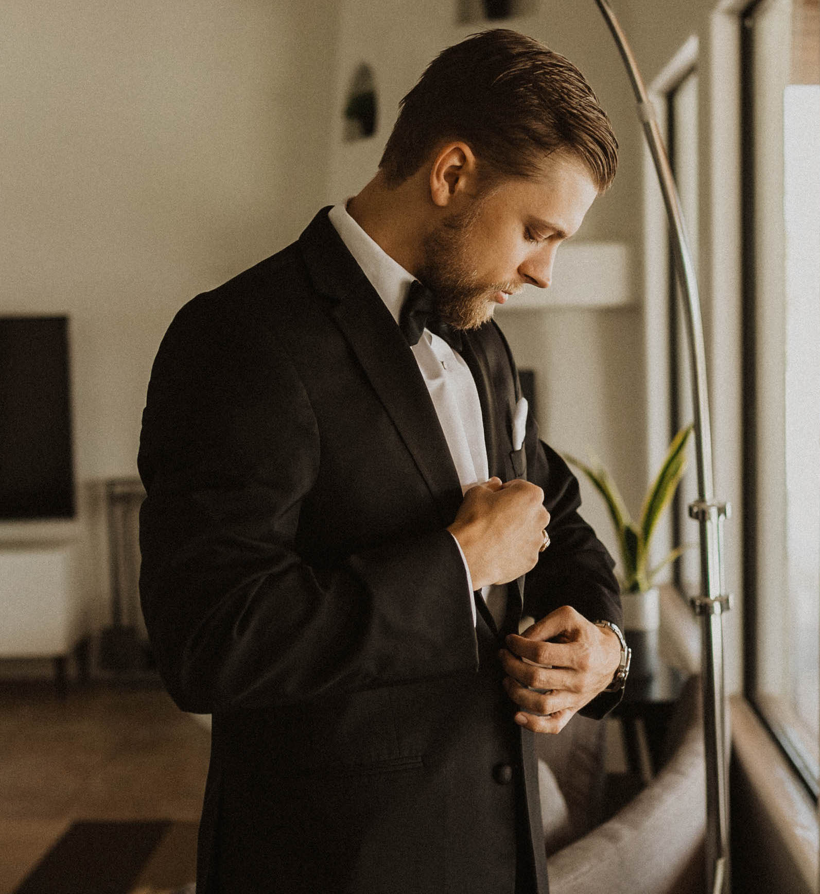 A groom gets ready for his destination elopement in Saguaro National Park, Arizona