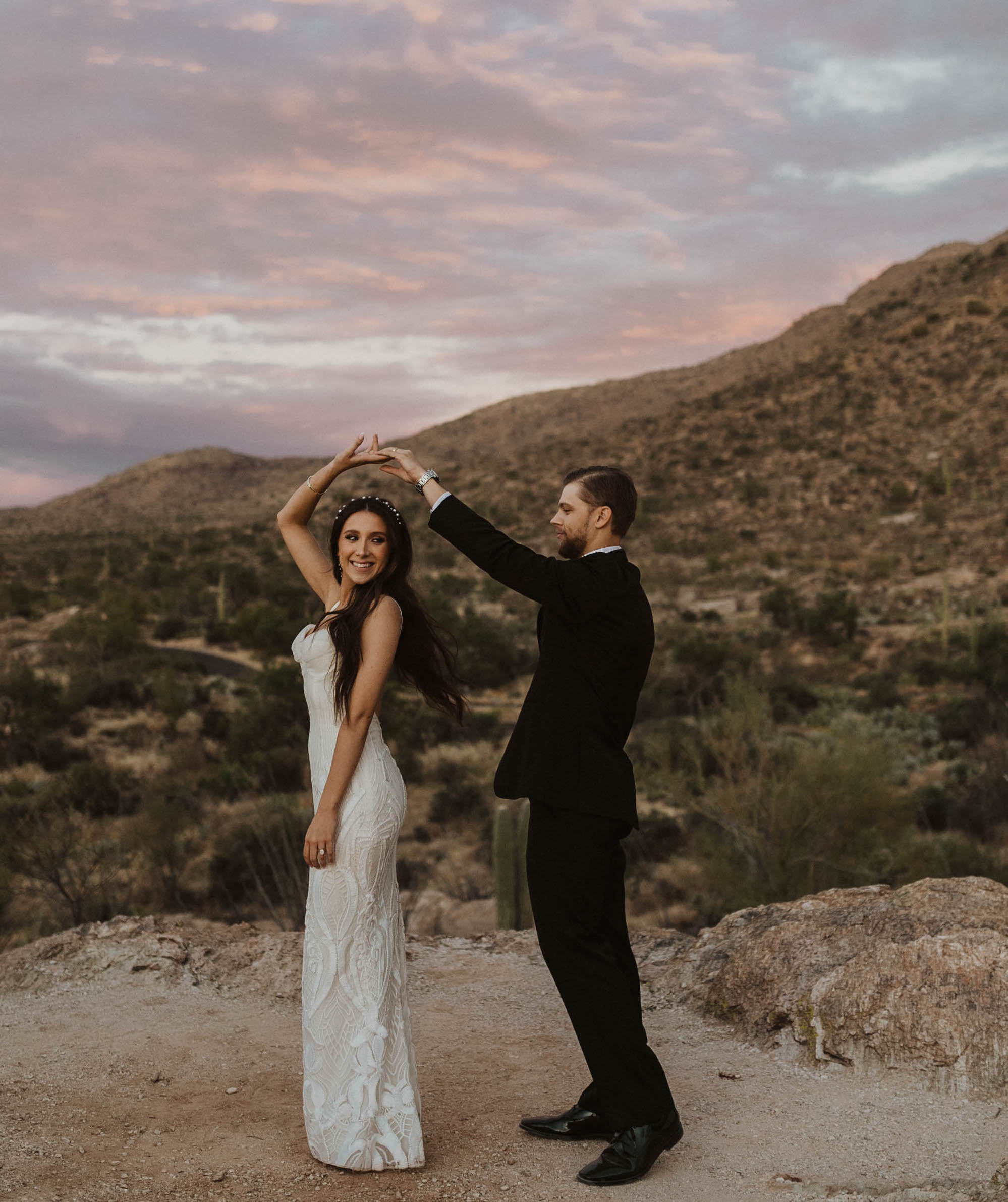 The groom twirls his bride who is the owner of Caked Up With Riley, a luxury cosmetic company in Texas.