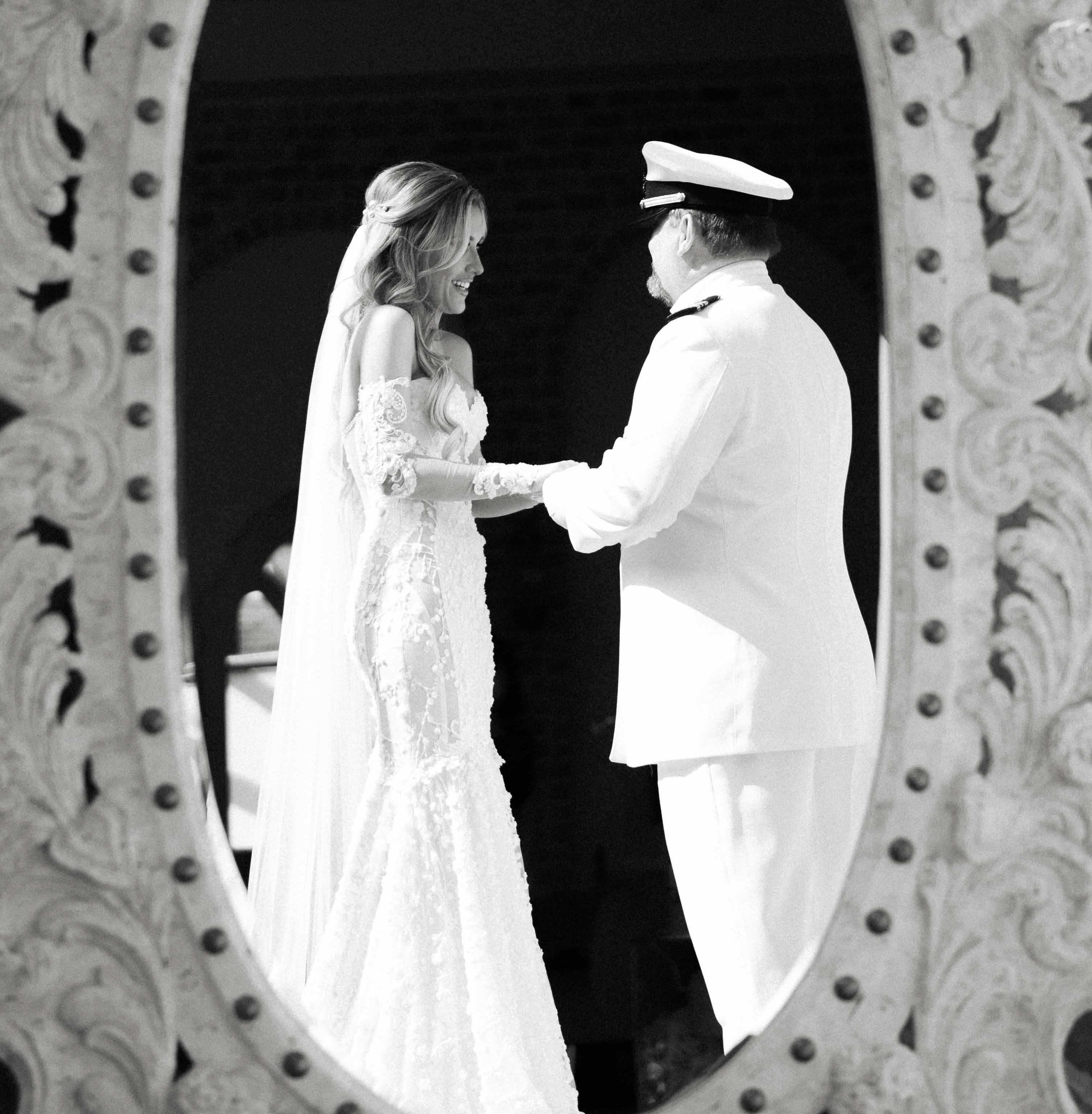 A bride holds hands with her dad before her wedding ceremony in Conroe, TX north of Houston.