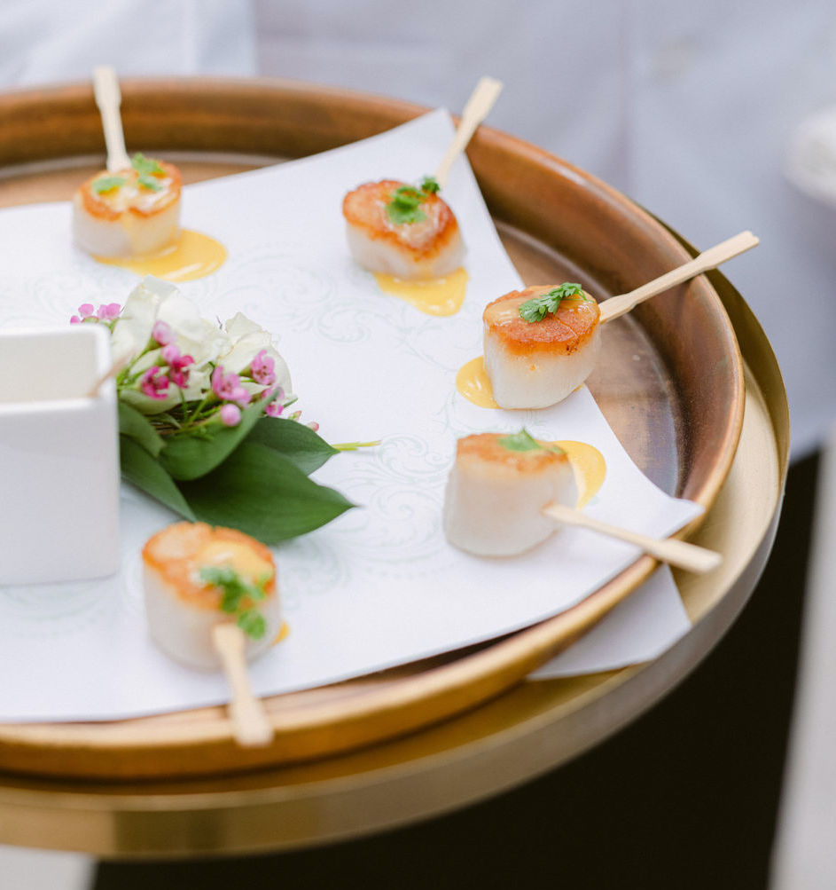 A platter of scallops for wedding guests.