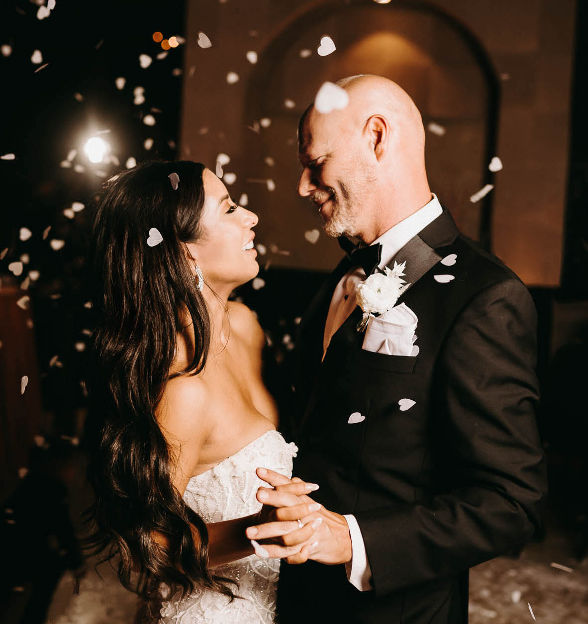 A bride and groom dance at their earth-toned wedding at The Bell Tower on 34th in Houston, TX.