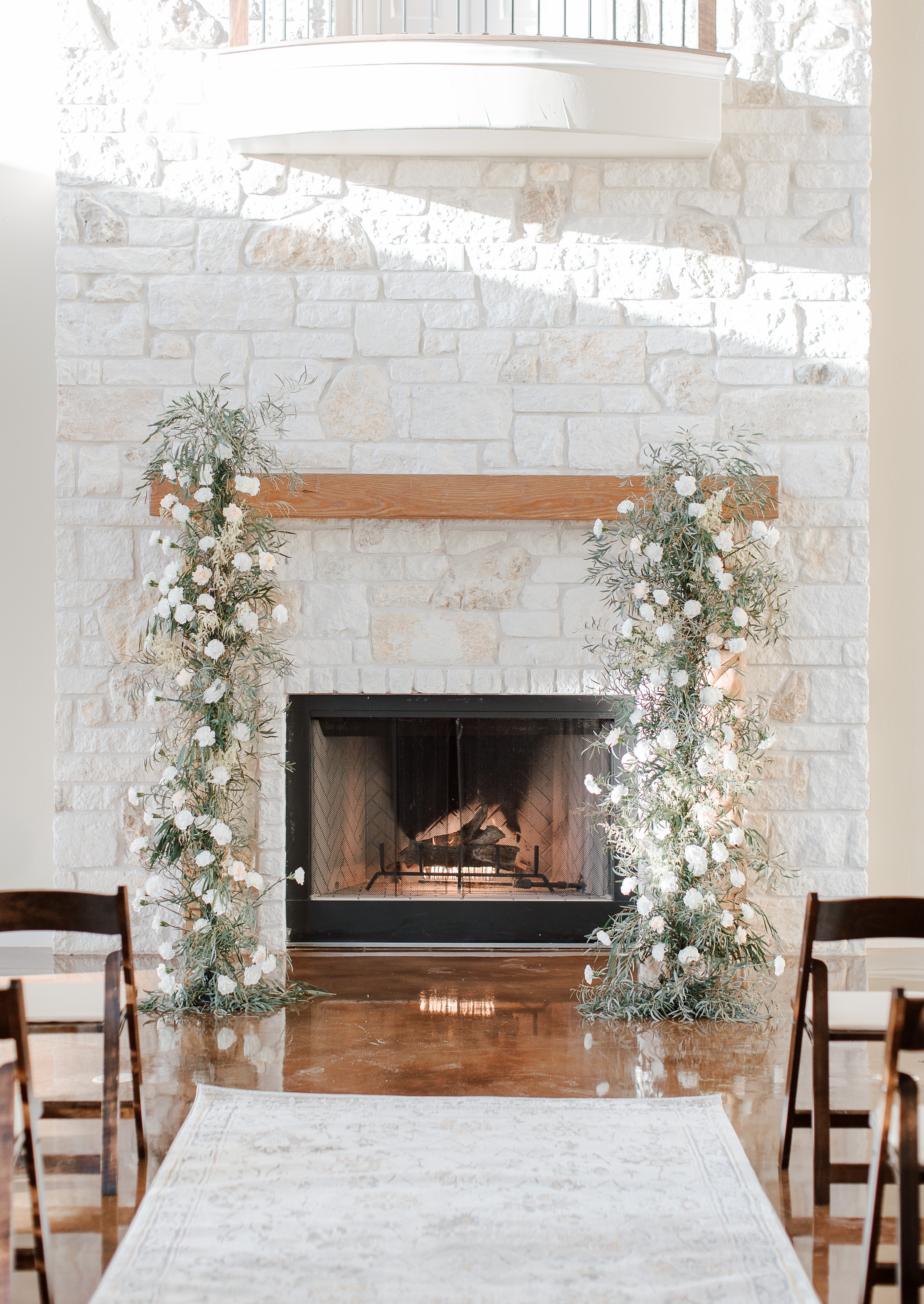 An intimate sunlit hill country wedding ceremony is set up at Cricket Hill Ranch in Dripping Springs, TX.