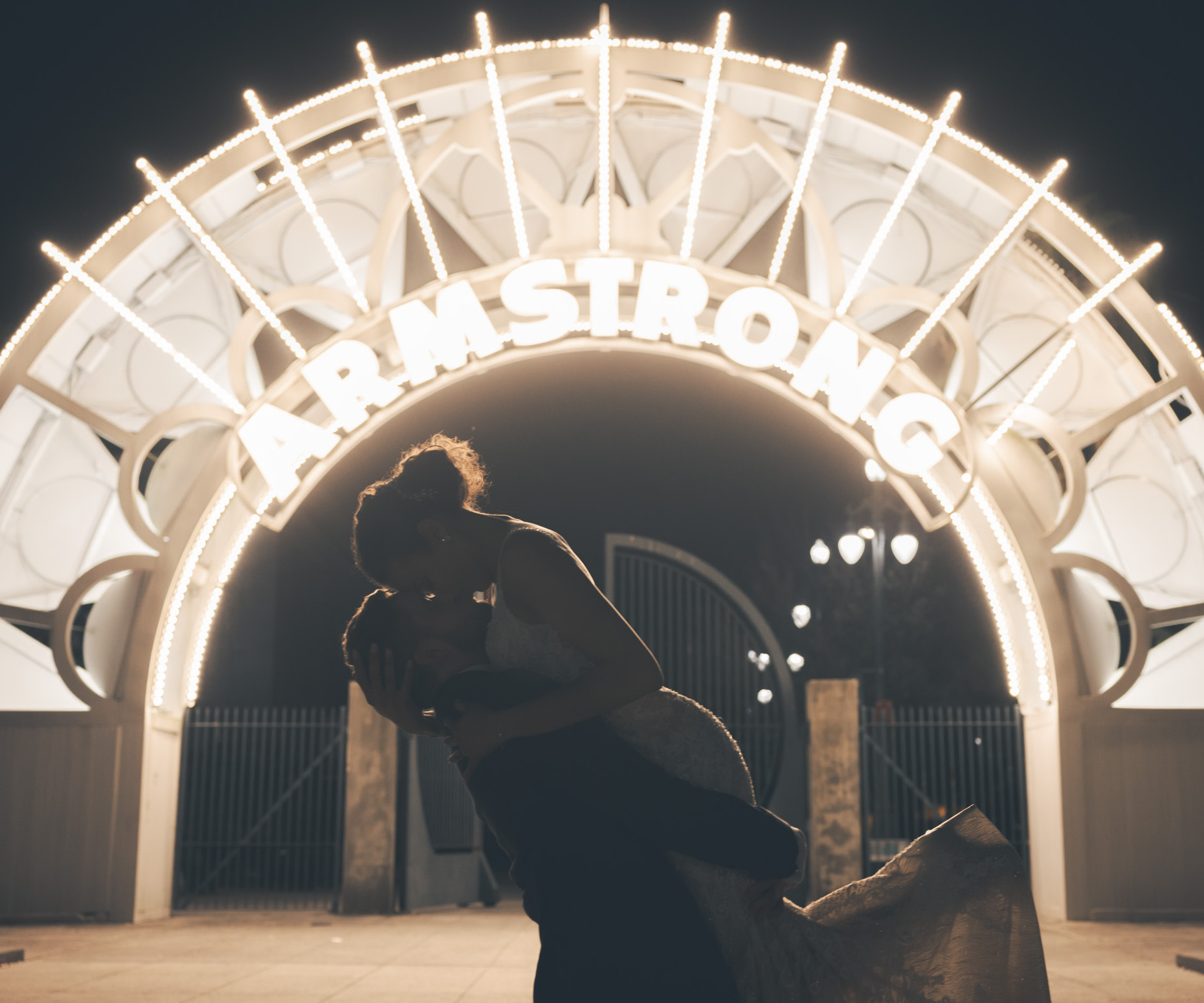 A groom picks up his bride during their NOLA destination wedding.