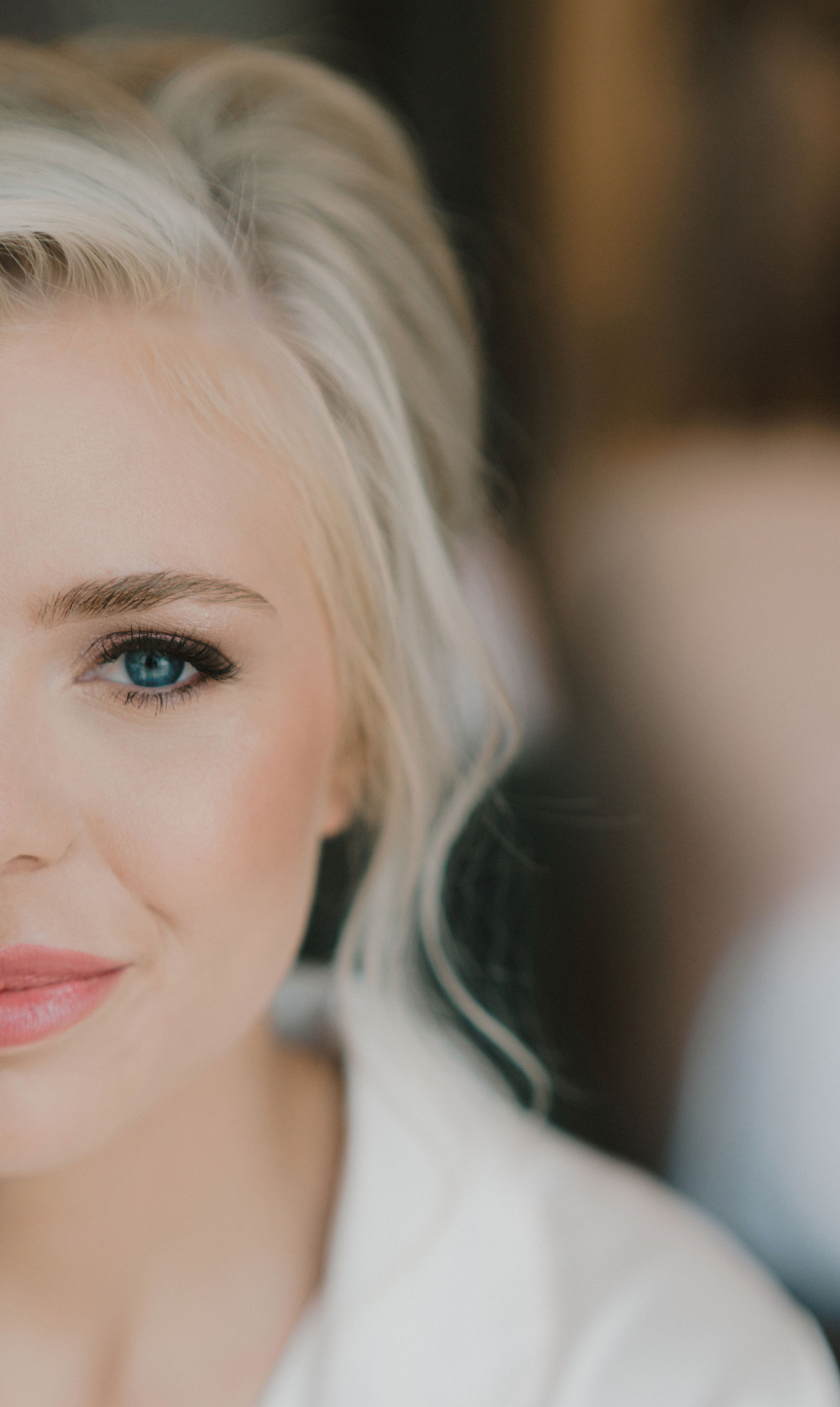 Portrait of a bride showing the right half of her face after bridal makeup application. 