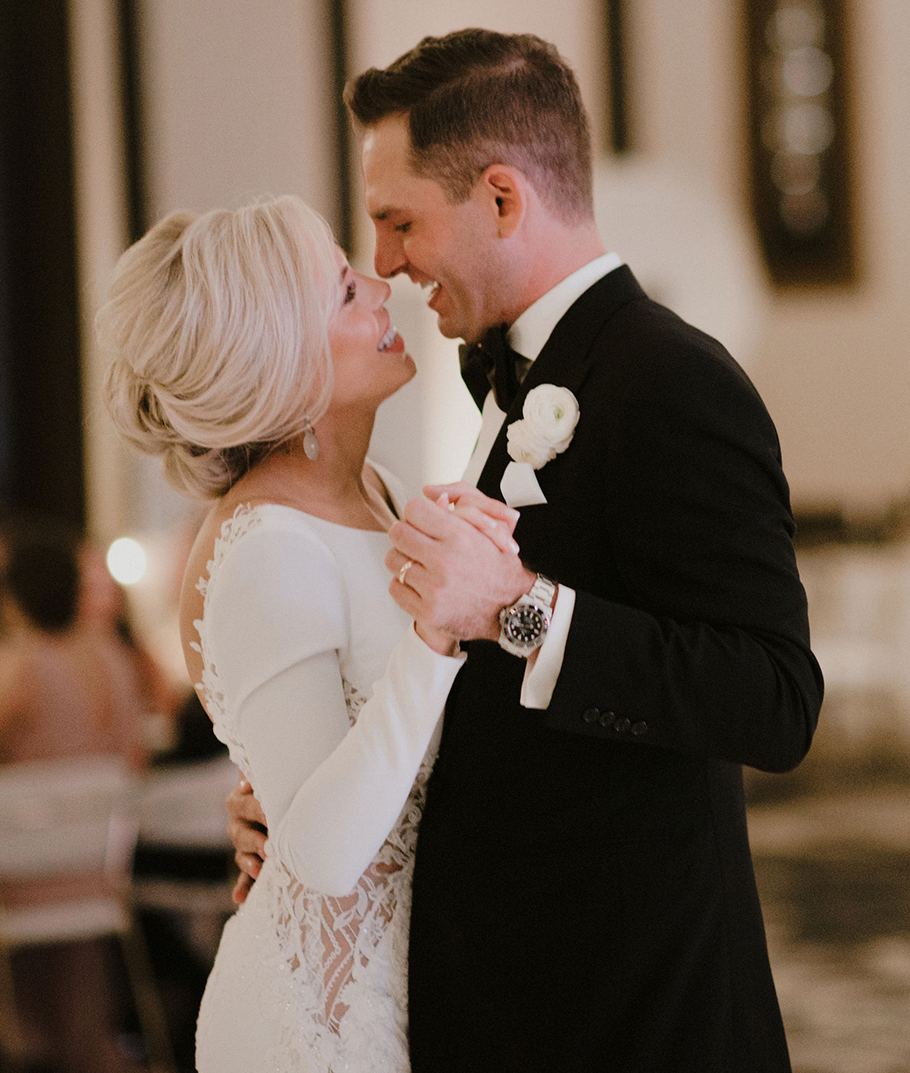 A bride and groom dance during their wedding reception in Houston, TX.