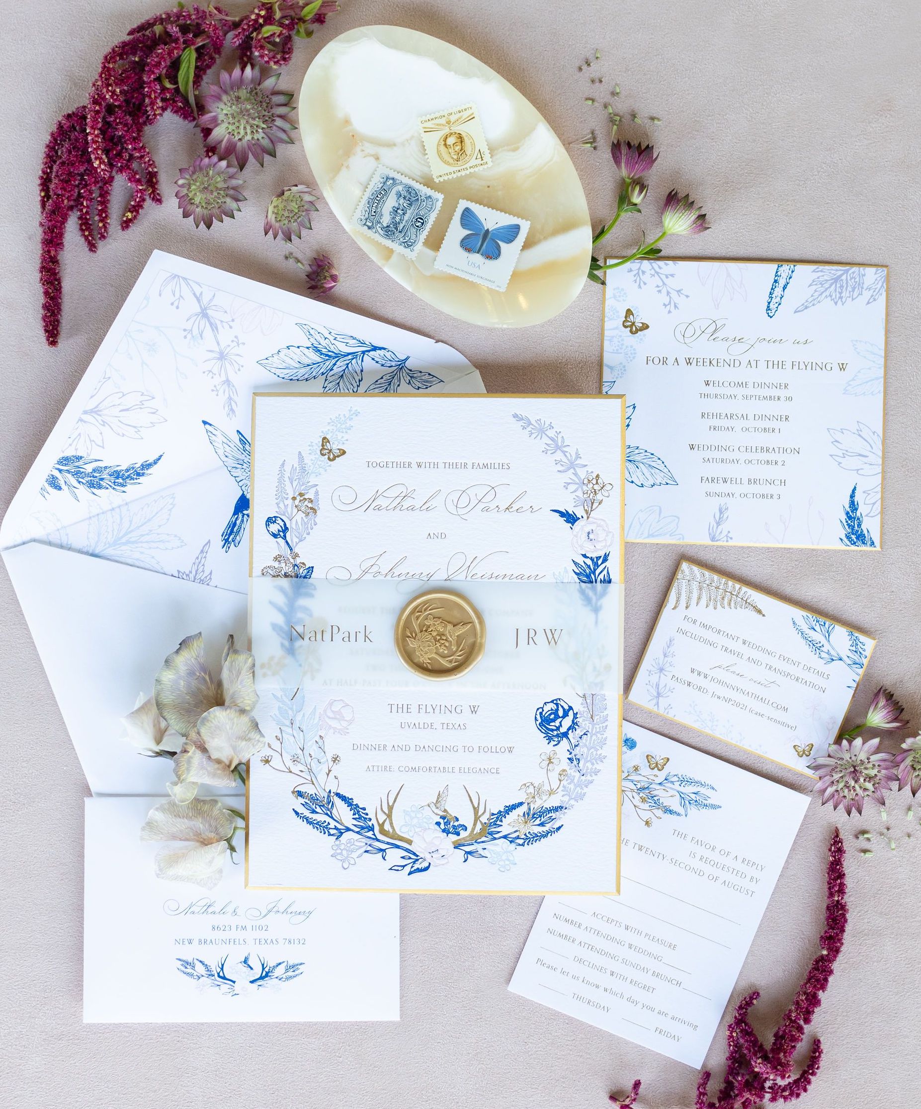 A purple, blue and white invitation suite for a wedding.