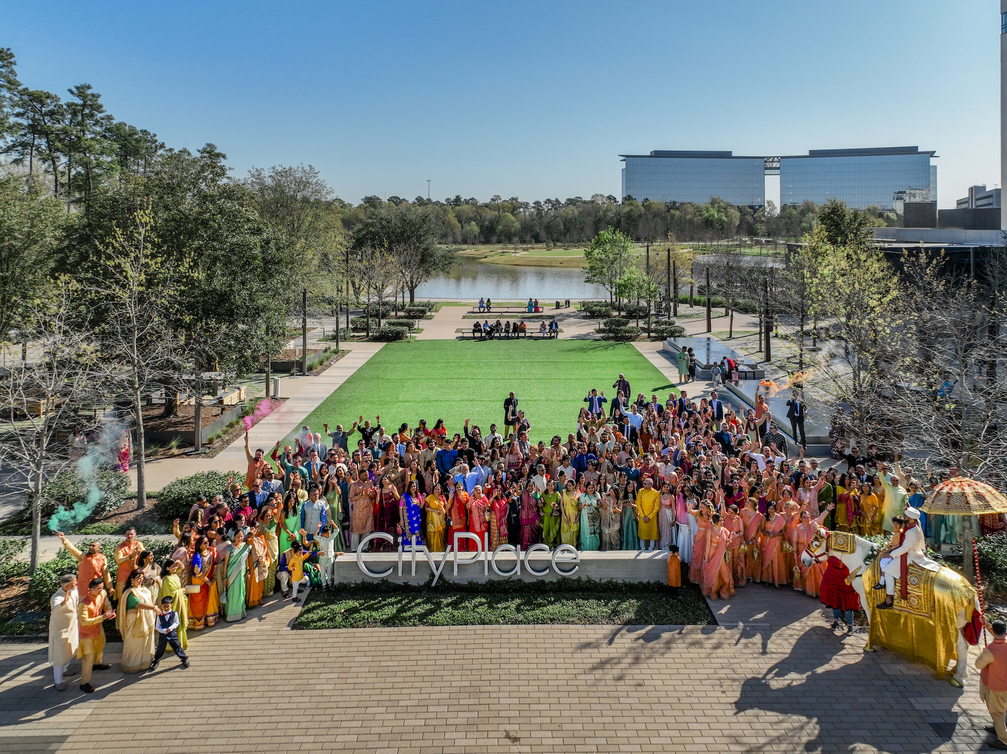 Guests gather around the Houston CityPlace Marriott sign before the Hindu Ceremony. 