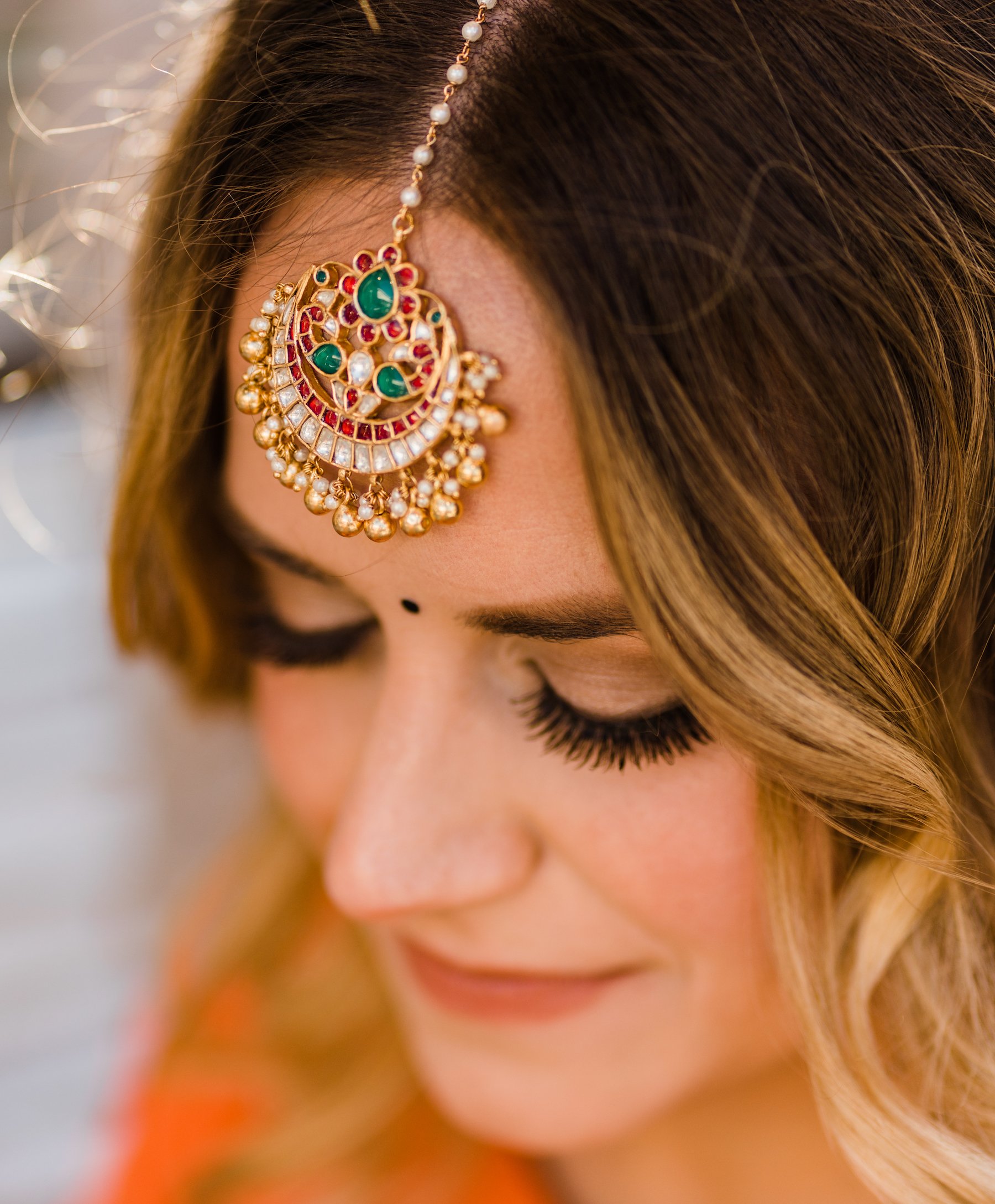 Bride wearing traditional Indian wedding attire. 