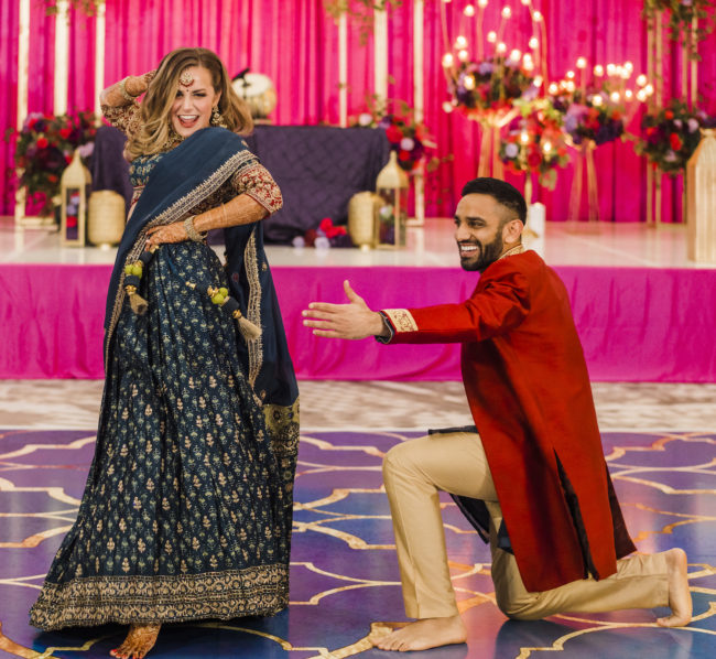 Bride and groom dance at Hindu ceremony at their wedding venue, Houston Cityplace Marriott.