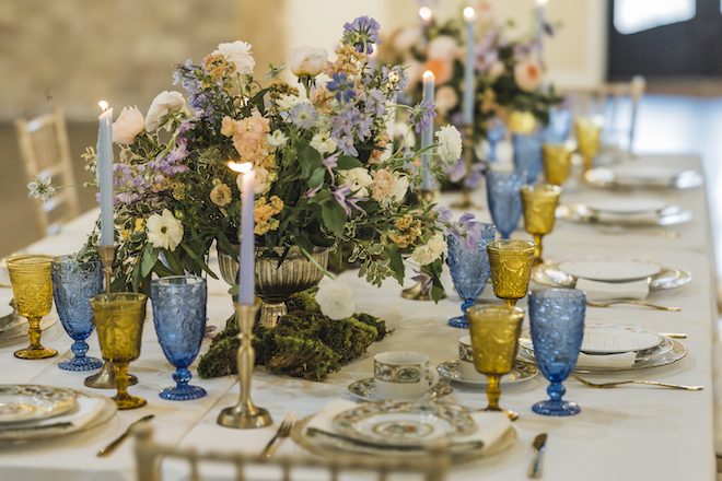 Peach, white and lilac floral centerpiece designed and created by Bloom and Grove. 