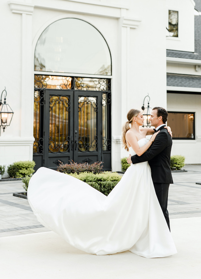 The bride and groom dance outside their wedding venue, The Peach Orchard. 