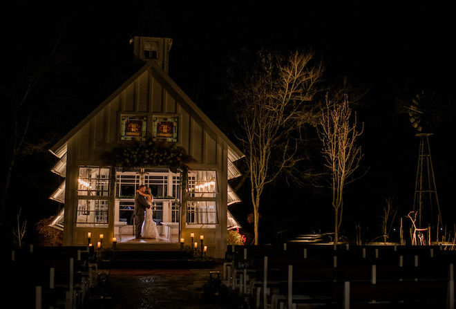 The couple having a private dance in the rustic-chic chapel at the end of the night.