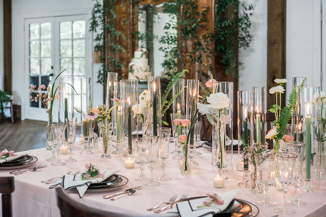 Candles and flowers decorating the reception table.