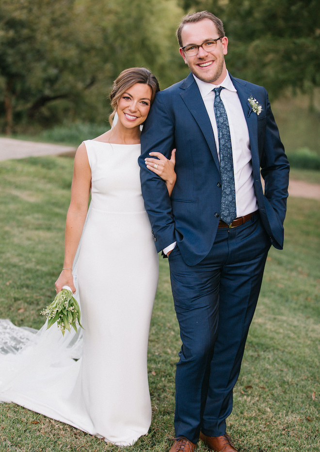 The bride and groom stand beside the Colorado River at their alfresco wedding.