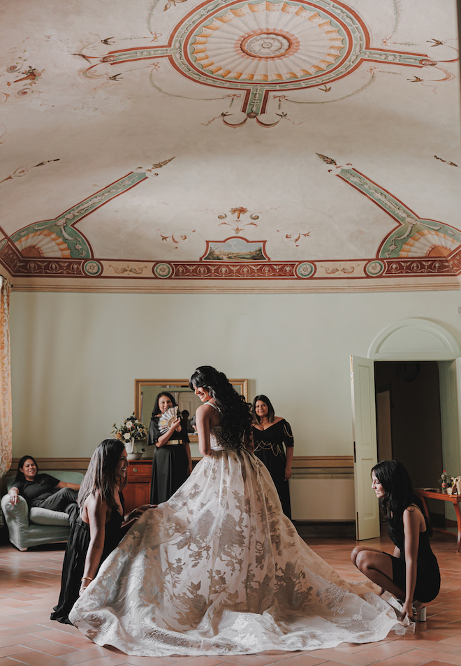 The bride getting ready before her intimate wedding in the Tuscan countryside.