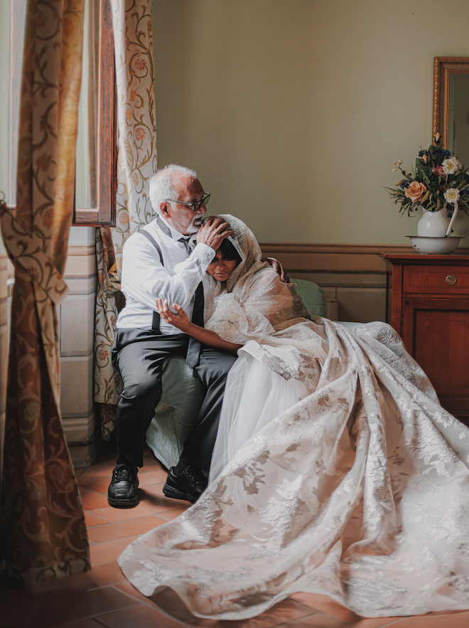 The bride hugging her father before the wedding ceremony.