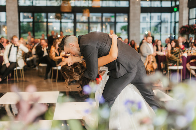 The groom dipping the bride on the dancefloor.